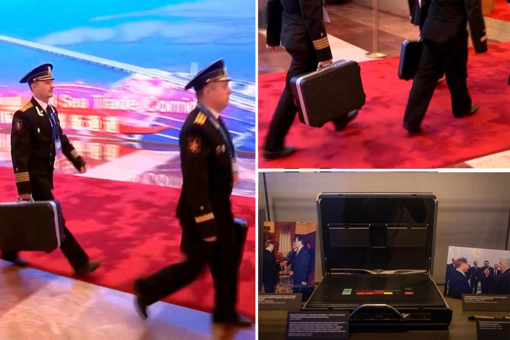 Putin filmed in China accompanied by officers with Russian nuclear briefcase