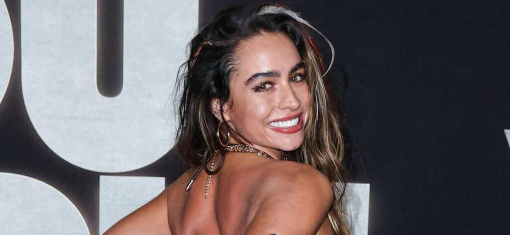 Sommer Ray In Her Tiny Animal-Print Bikini Holds A Big Bottle Of Wine