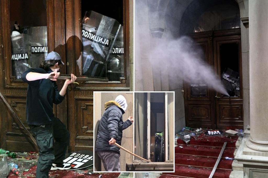 Serbian police fire tear gas at election protesters threatening to storm capital’s city hall