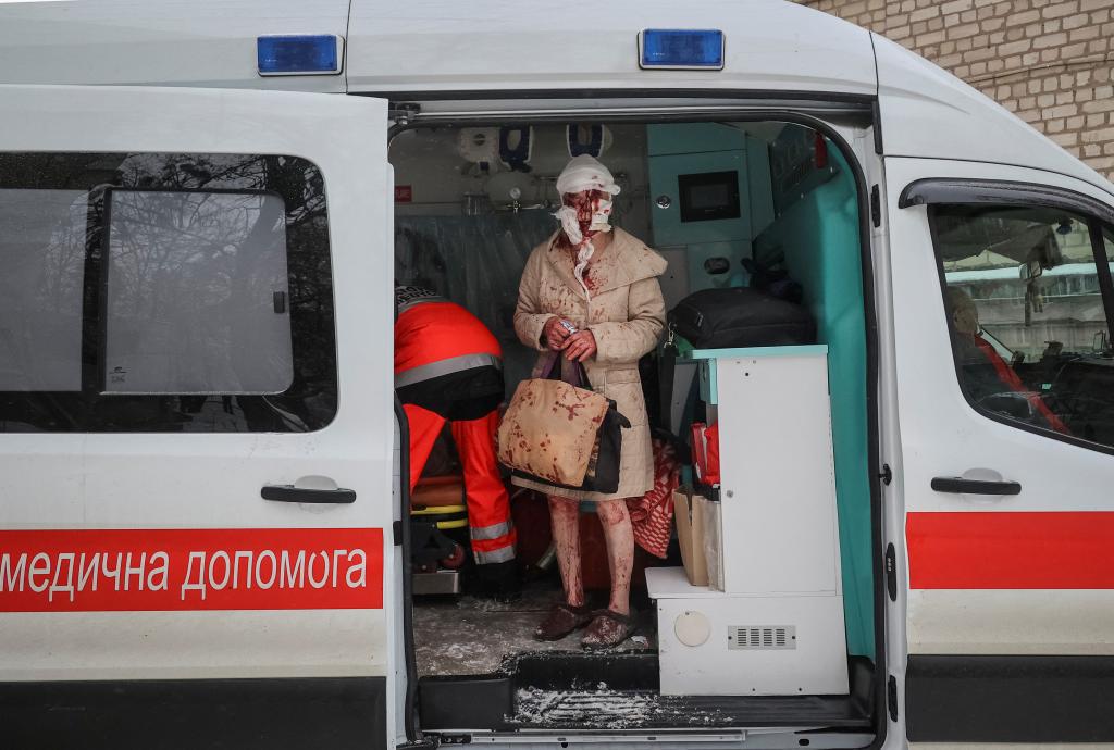 Blood-soaked woman with shopping bags pictured in Ukraine as 6 killed in Russian attack