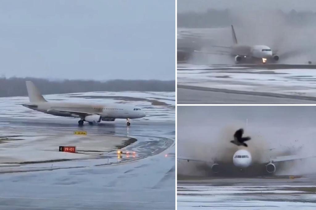 Dramatic video shows plane skidding across icy runway and onto muddy grass