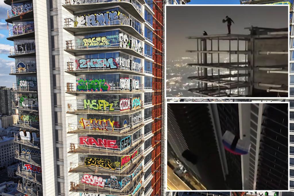 Parachuters leap from roof of graffiti-ridden abandoned Los Angeles skyscraper: video