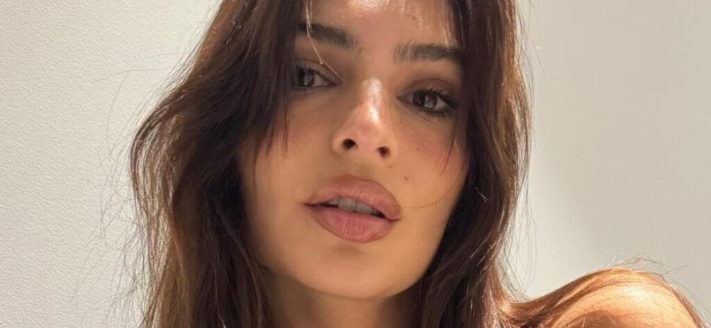 Emily Ratajkowski Exposes Chest In Classy Balcony Look